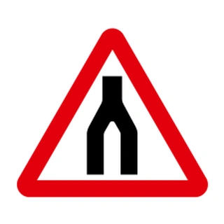 Road narrows on both sides