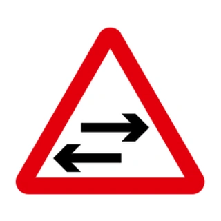 Two-way traffic crosses one-way road